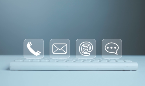 Phone, mail, social media and messaging icons above a keyboard.
